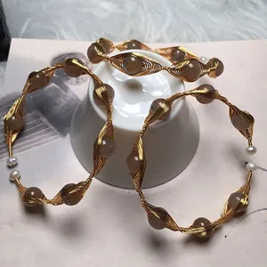 Handmade 14K gold wire wrapped bangle set with freshwater pearls and brown gemstones
