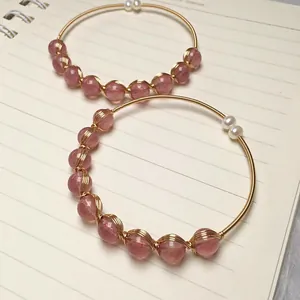 Pink strawberry crystal bangles with 14K gold filled wire wrapping and pearl accents