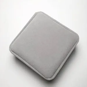 Macro shot of square gray velvet jewelry box with smooth texture for bracelets