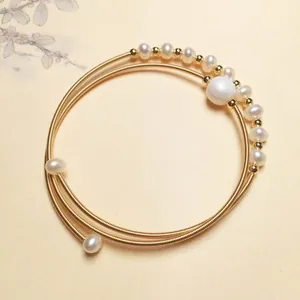 Multi-layer 14K gold plated wire wrap bracelet with white freshwater pearls