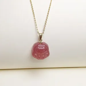 Detailed view of pink strawberry quartz cat paw pendant with delicate gold-plated chain