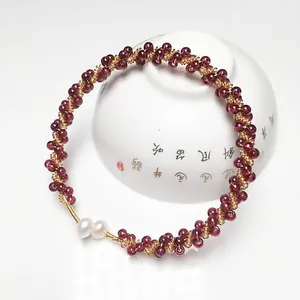 Handmade garnet beaded bangle with 14K gold-filled wire and elegant pearl accents