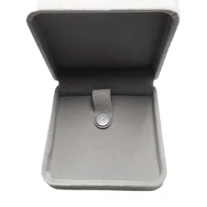 Elegant light gray velvet jewelry box with snap button closure for necklace and bracelet