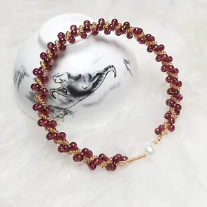 Handmade garnet beaded bracelet with 14K gold wire and white pearl accent