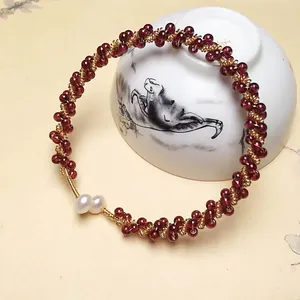 Handcrafted garnet bead bracelet with 14K gold-filled wire and freshwater pearls
