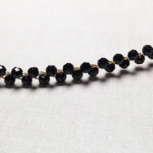 Detail of faceted burgundy garnet beads hand-wrapped with 14K gold filled metal wire