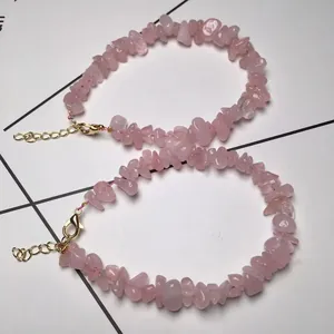 Detail view of pink crystal stone bracelet with adjustable gold-tone lobster clasp