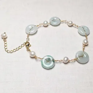 Detailed view of freshwater pearl and jadeite ring bracelet with 14K gold lobster clasp