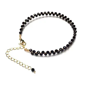 Macro shot of 14K gold filled garnet bead bracelet with lobster clasp and chain