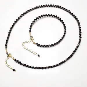 Detailed set of black faceted bead necklace and bracelet with gold-plated adjustable clasps