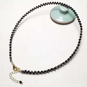 Macro shot of faceted black spinel beads with adjustable 14K gold-plated lobster clasp
