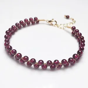 Detail of garnet beaded bracelet with double-row weave and 14K gold-filled lobster clasp