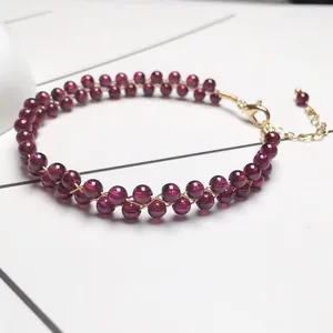 Detail of double-layer garnet bead bracelet with adjustable 14K gold lobster clasp