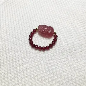 Beaded ring with garnet round stones and carved strawberry quartz Pixiu centerpiece