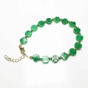 Detail of green chalcedony clover bracelet with 14K gold lobster clasp and chain