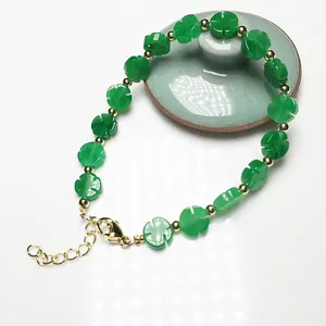 Elegant jade green clover bead bracelet with 14K gold-plated accents and lobster clasp