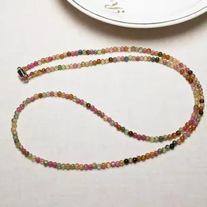 Detail of multi-layered tourmaline bead bracelet with a cylinder magnetic metal clasp