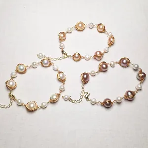 Detailed view of handmade 14K gold-filled wire wrapped freshwater pearl bracelets