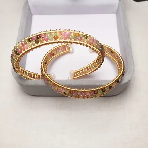Detailed wire-wrapped 14K gold-filled tourmaline bracelet with pearl ends in a jewelry box