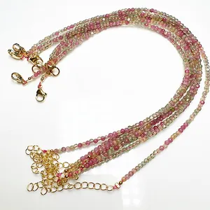 Detail of 2.4mm candy colored tourmaline beaded anklets with golden lobster clasps