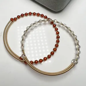 Handmade 14K wire wrapped crystal bracelet set with garnet and labradorite beads