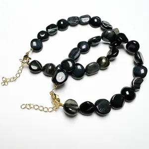 Blue Tiger Eye stone bracelet set with 14K gold lobster clasp and adjustable chain