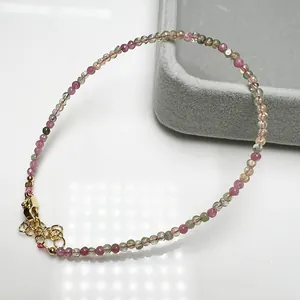 2.4mm candy colored tourmaline anklet with adjustable gold chain on white background