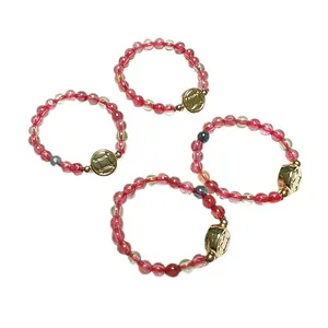 Beaded crystal ring set with garnet and tourmaline featuring 14K gold-plated coin charms
