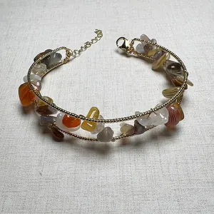 Detailed close-up of double-layer wire wrapped bracelet with natural crushed gemstones