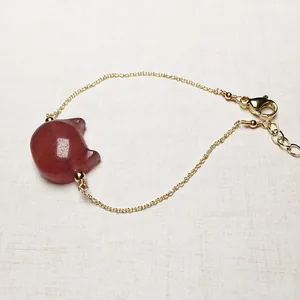 Elegant strawberry quartz bracelet with cat-shaped pendant on gold chain for women