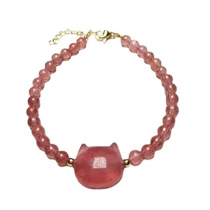 Pink strawberry quartz beaded bracelet with cat head charm and golden lobster clasp