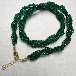 Detail of dark green faceted spinel beads necklace with adjustable gold lobster clasp