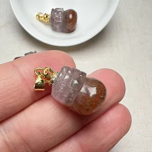 Macro view of Auralite 23 Pi Xiu pendant with S925 silver gold-plated crown clasp