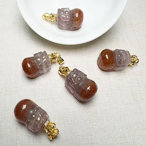 Detailed macro view of five natural Auralite 23 pendants with golden crown clasps