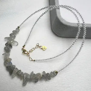 Macro detail of natural labradorite beaded necklace with 925 silver gold-plated lobster clasp