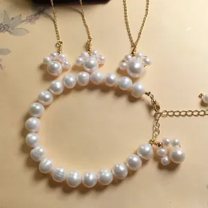 Detail of freshwater pearl bracelet set with cute golden cat claw charms and pendants