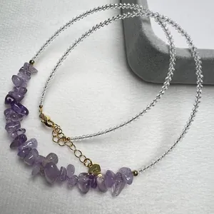 Detailed macro view of S925 silver clasp and purple crystal beaded necklace