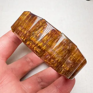 Breites Armband aus goldenem Rutilquarz mit rechteckigen facettierten Perlen