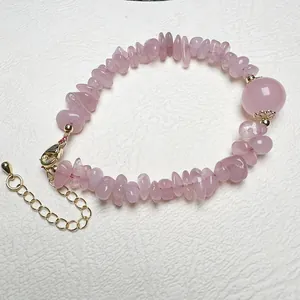 Detail of pink crystal chips bracelet with large bead and gold adjustable lobster clasp