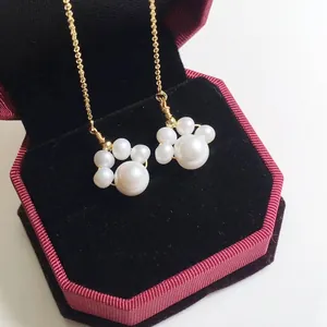Elegant 14K gold plated freshwater pearl earrings featuring a cute cat paw design
