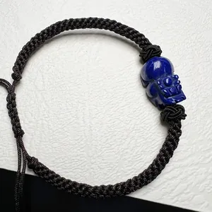 Handmade woven lapis lazuli skull bracelet with adjustable knot and dark twisted rope