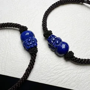 Two-piece handcrafted lapis lazuli PiXiu bracelets with black braided cord and knots