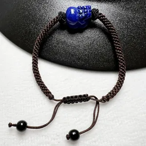 Hand-woven Lapis Lazuli PiXiu bracelet with brown cord and adjustable drawstring clasp