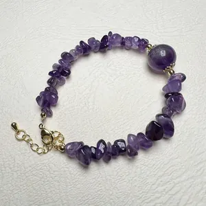Natural amethyst chip stone bracelet with a large purple bead and gold lobster clasp