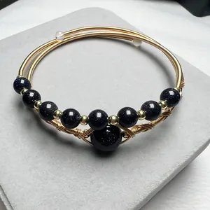 Handmade 14K gold filled wire wrapped bracelet with dark blue sandstone beads