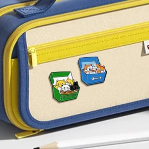 Detail of cute cat pizza enamel pins on a canvas pencil case with creative metal finish