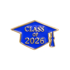 Detailed close-up of blue Class of 2026 graduation cap enamel pin with gold lettering