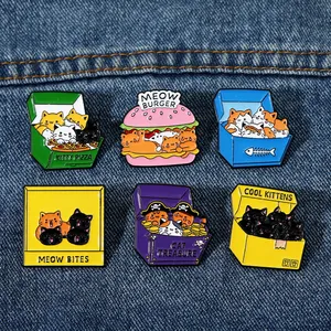 Cute cartoon cat enamel pins set featuring meow burgers and treasure boxes on denim background