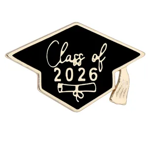 Detail of the black enamel 2026 graduation cap pin with gold scroll and tassel