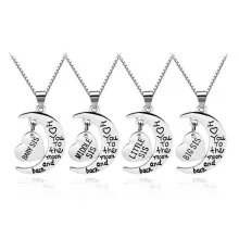 Detail view of 4-piece sister necklace set with moon and engraved heart charms